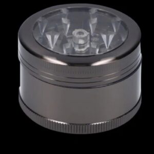 A metallic herb grinder with a transparent top and sharp teeth inside.