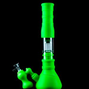 Bright green silicone bong with a black background.