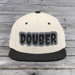 White and black cap with bold 'DOUBER' text embroidered.